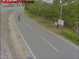 Jap schoolgirl Rides toy Motorcylcle