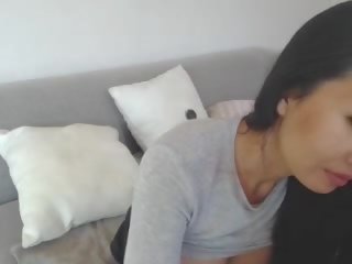 Bewitching Asian Leilee Webcam Teasing on the Sofa: Free sex movie 0e
